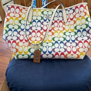 A beautiful rainbow coach purse